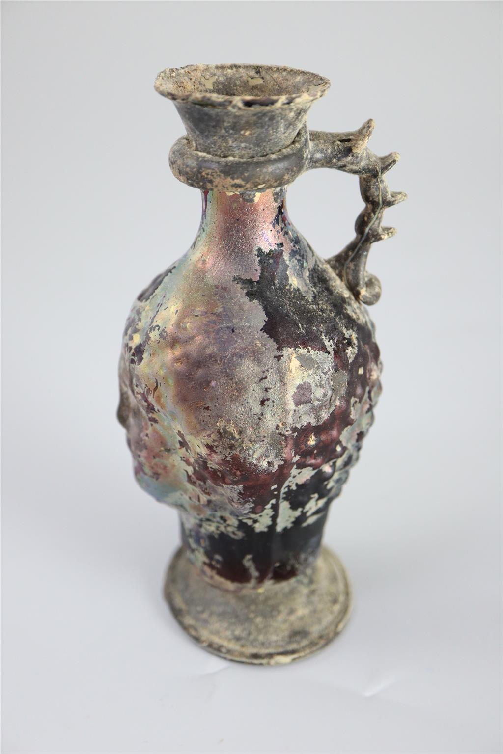 A Roman amethyst glass ewer, 1st/2nd century AD, 15.2cm high